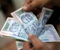 Rupee opens 25 paise lower against dollar at 67.28