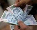 Rupee tumbles 20 paise on buoyant dollar, capital outflows