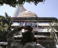 Sensex trims gains to settle flat ahead of Q2 GDP data