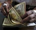 Rupee gains on surprise RBI rate cut, up 13 paise to 66.46