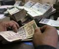 Rupee runs up more losses, down 8 paise against dollar