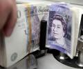 What brought British pound down to a 31-year low today?