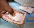 Rupee ends flat at 67.02 vs USD ahead of Fed meet outcome