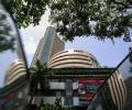 Sensex back in red, down 105 points as banks weigh