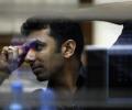 Sensex, Nifty end lower on deficit concerns