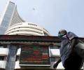 Sensex, Nifty end flat on muted global cues