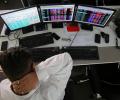 Sensex, Nifty end in red; HCL Tech rallies over 4%