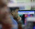 Sensex makes a sharp U-turn to finish 64 points lower