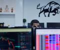 Sensex, Nifty settle almost flat in lacklustre trade