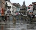 Curfew in various J-K districts; army stages flag march