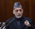 Karzai arrives in India; to seek military aid