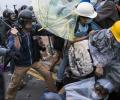Hong Kong protesters scuffle with cops outside government offices