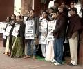 Wearing black shawls, Trinamool MPs protest outside Parliament