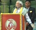 Modi shares stage with Ramdev; promises relook at taxation system