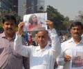 Devyani's father leads protest outside US consulate in Mumbai