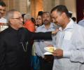 Have some more, no harm: Pranab tells Kejriwal at tea party