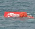 Crashed AirAsia plane's tail lifted from seabed