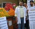 Why are these doctors selling fruits?