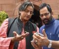 Caption this: What's Tharoor telling Naqvi?