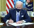 Biden signs executive actions on COVID, climate change