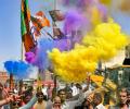 BJP, AAP celebrate early Holi with poll victory