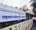 Supporters gather outside residences of Sharad, Ajit Pawar
