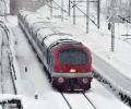 A Train Chugs Along In The Kashmir Snow