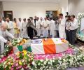 Rupani cremated with full state honours; Shah leads tributes