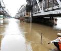 Families wade through water as Yamuna enters houses in Delhi