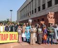 Opposition calls US trade pact a 'trap deal', steps up protest