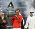 Federer subdues Berdych to win sixth Dubai title