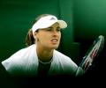 Hingis sweeps into second round
