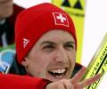 Swiss Ammann soars to first gold