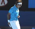 Federer, Serena advance; Soderling bows out