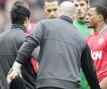 Suarez apologises for not shaking Evra's hand