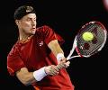 Hewitt in third round after Roddick retires