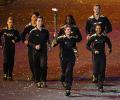 Young British athletes light Olympic cauldron