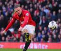 Wenger admits interest in signing Rooney, Fabregas