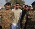 Boxer Amir Khan visits Pakistan school massacre site
