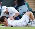 Wimbledon: Massaged Murray bites back to reach last 16