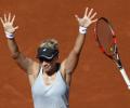 PHOTOS: Third seed Halep knocked out of French Open
