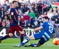 La Liga: Messi treble lifts Barca to the top of table