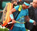French Open: Nadal trails as rain suspends play