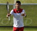 Djokovic says not among favourites at Wimbledon, backs Federer