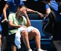 Heartbreak for France's Tan as she exits Aus Open on wheelchair