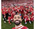Slot, Salah in record books as Liverpool lift EPL title