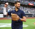 PIX: Djokovic Swaps Racket for Baseball at Yankees Game