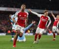 PICS: Arsenal thump City to stay in title race