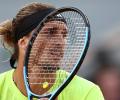 Zverev fights through stomach ailment to beat Cobolli