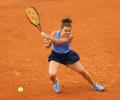 Paolini survives Yuan scare at French Open